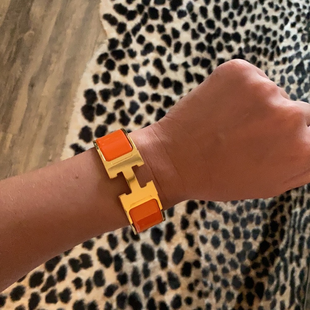Hermès orange enamel clic clac bracelet